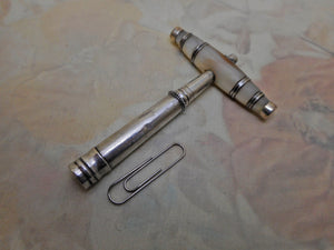 A Georhian silver and pearl mounted pocket corkscrew by Matthew Linwood.