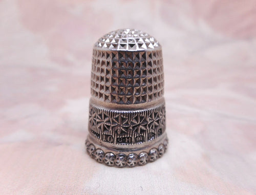 An antique silver thimble by Charles Horner. Chester 1899