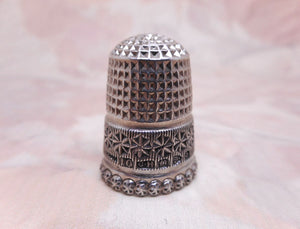 An antique silver thimble by Charles Horner. Chester 1899