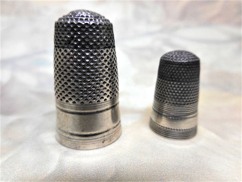 Two Georgian silver thimbles with steel caps for mother and daughter. c 1800