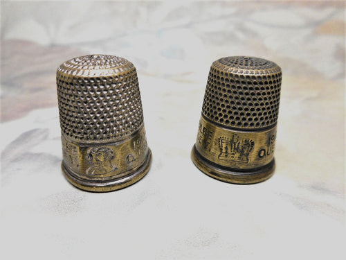 Two base metal thimbles commemorating George V Jubilee